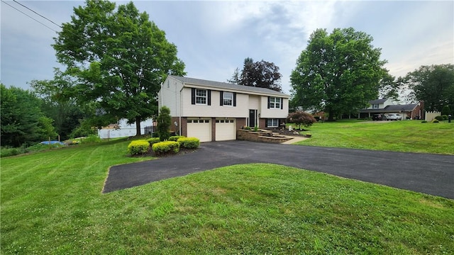 2583 Richard Rd, Franklin Park, PA 15090 - bi-level home featuring asphalt driveway, a garage, brick siding, and a front lawn