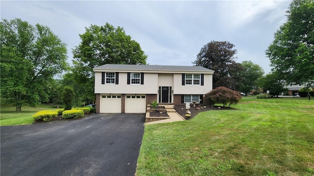 2583 Richard Rd, Franklin Park, PA 15090 - split foyer home featuring brick siding, asphalt driveway, a front lawn, and a garage