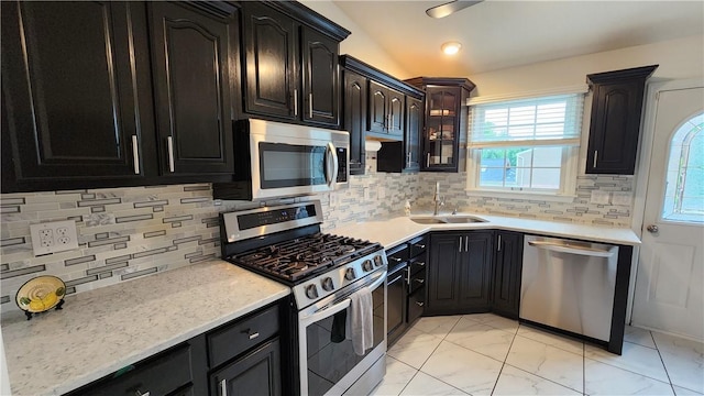 2583 Richard Rd, Franklin Park, PA 15090 - kitchen featuring appliances with stainless steel finishes, plenty of natural light, light marble finish floors, and decorative backsplash