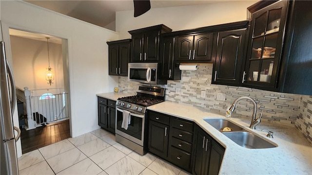 2583 Richard Rd, Franklin Park, PA 15090 - kitchen featuring appliances with stainless steel finishes, backsplash, glass insert cabinets, dark cabinets, and lofted ceiling