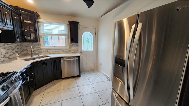 2583 Richard Rd, Franklin Park, PA 15090 - kitchen featuring appliances with stainless steel finishes, light marble finish floors, light countertops, glass insert cabinets, and backsplash