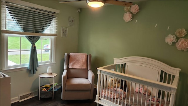 2583 Richard Rd, Franklin Park, PA 15090 - bedroom featuring dark wood-type flooring, a ceiling fan, and a nursery area