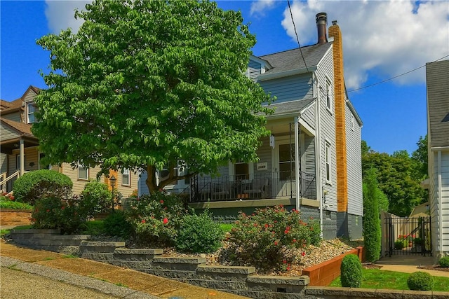 1009 Roselawn Ave, Harmony Twp, PA 15003 - view of front of home featuring covered porch and a chimney