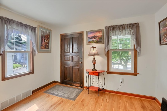 1009 Roselawn Ave, Harmony Twp, PA 15003 - foyer entrance with plenty of natural light and wood finished floors