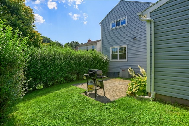 1009 Roselawn Ave, Harmony Twp, PA 15003 - view of green lawn featuring a patio area