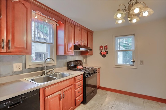 1009 Roselawn Ave, Harmony Twp, PA 15003 - kitchen featuring black appliances, healthy amount of natural light, under cabinet range hood, and a chandelier