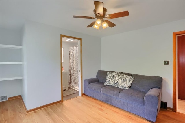 1009 Roselawn Ave, Harmony Twp, PA 15003 - living area with a ceiling fan, wood finished floors, and built in features