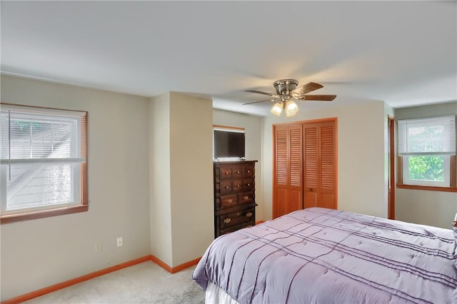 1009 Roselawn Ave, Harmony Twp, PA 15003 - bedroom featuring a closet, light colored carpet, and a ceiling fan