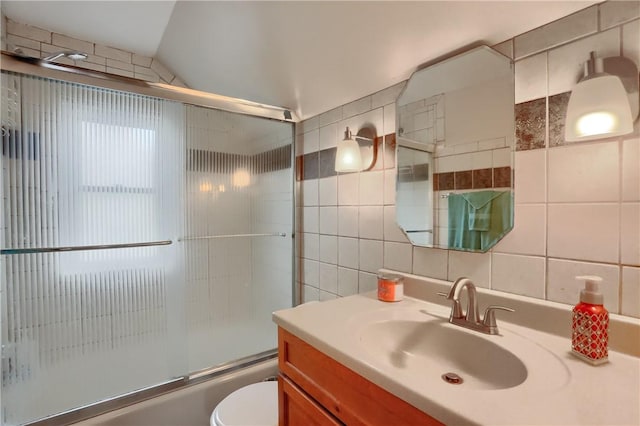 1009 Roselawn Ave, Harmony Twp, PA 15003 - bathroom featuring tile walls, vanity, shower / bath combination with glass door, and decorative backsplash