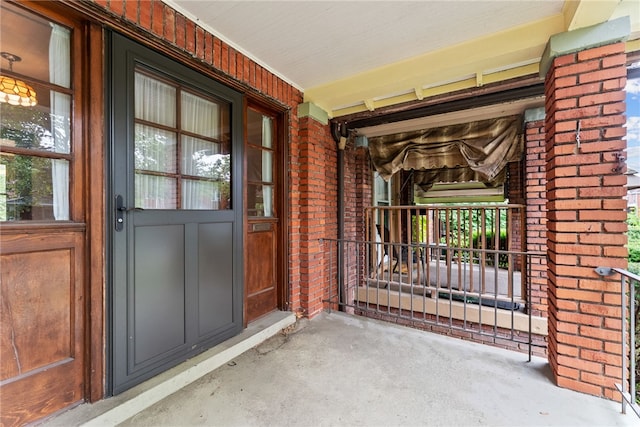 208 E 19th Ave, Munhall, PA 15120 - entrance to property with covered porch and brick siding