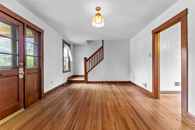 208 E 19th Ave, Munhall, PA 15120 - entryway with wood-type flooring, stairs, and a chandelier