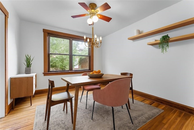 208 E 19th Ave, Munhall, PA 15120 - dining area featuring a chandelier, light wood-type flooring, a ceiling fan, and lofted ceiling