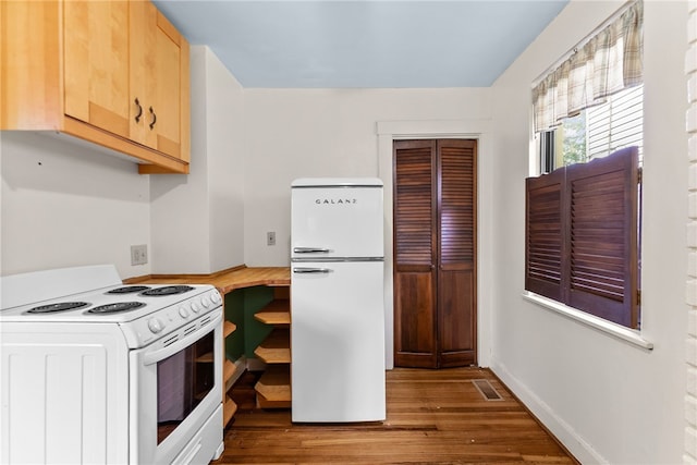 208 E 19th Ave, Munhall, PA 15120 - kitchen featuring white appliances, wood finished floors, light brown cabinetry, and wooden counters
