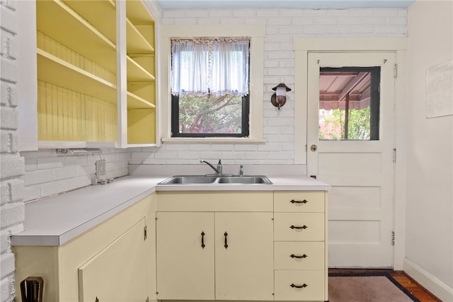 208 E 19th Ave, Munhall, PA 15120 - kitchen featuring light countertops, backsplash, and healthy amount of natural light