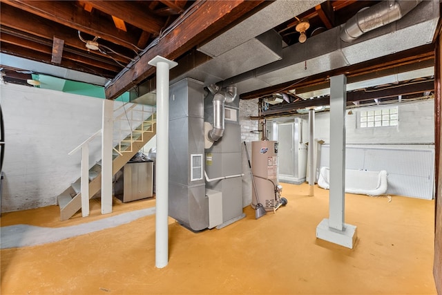 208 E 19th Ave, Munhall, PA 15120 - below grade area with gas water heater, heating unit, and stairway
