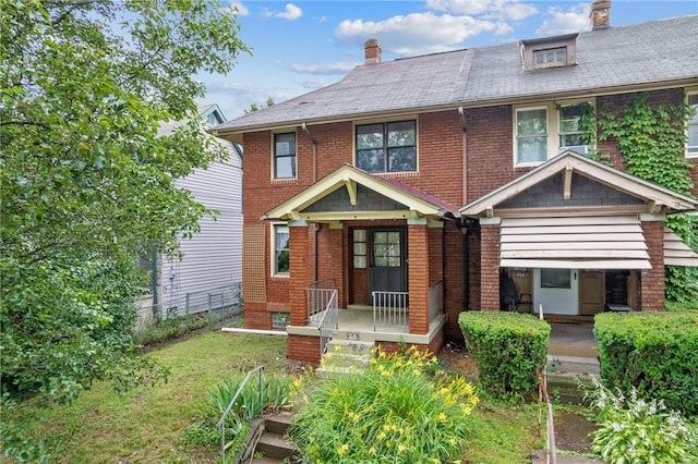 208 E 19th Ave, Munhall, PA 15120 - view of front facade featuring a chimney and brick siding