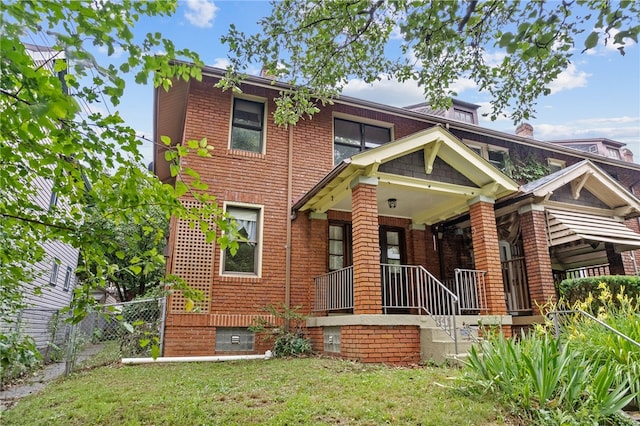 208 E 19th Ave, Munhall, PA 15120 - view of front facade featuring brick siding and a porch