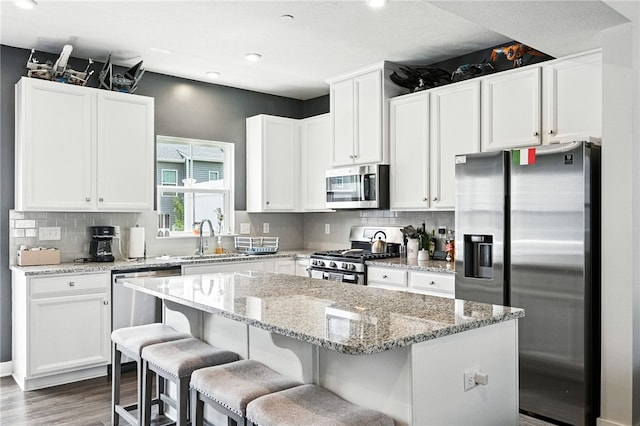 4022 Crown Dr, South Park, PA 15129 - kitchen featuring stainless steel appliances, dark wood-style floors, a center island, white cabinetry, and recessed lighting