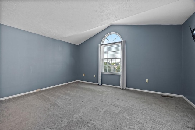 2692 Hunters Point Dr, Franklin Park, PA 15090 - unfurnished room with vaulted ceiling, a textured ceiling, and carpet flooring