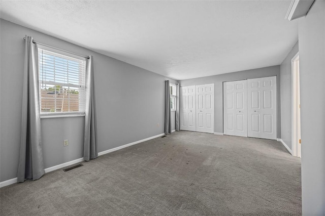 2692 Hunters Point Dr, Franklin Park, PA 15090 - unfurnished bedroom with multiple closets and carpet flooring