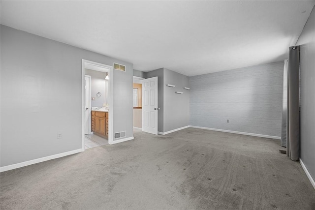 2692 Hunters Point Dr, Franklin Park, PA 15090 - unfurnished bedroom with an accent wall, light carpet, and ensuite bath