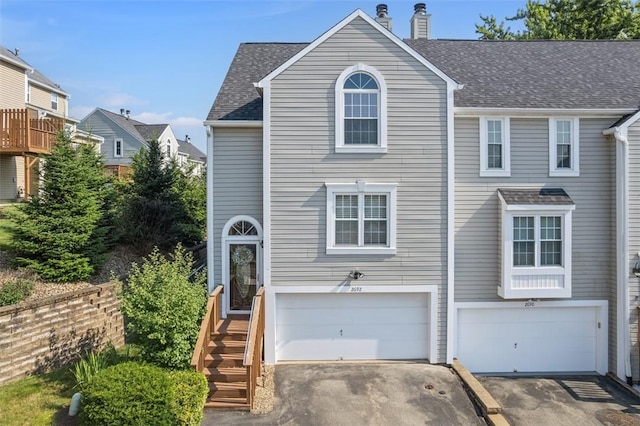 2692 Hunters Point Dr, Franklin Park, PA 15090 - view of front of home featuring asphalt driveway, an attached garage, a chimney, and a shingled roof
