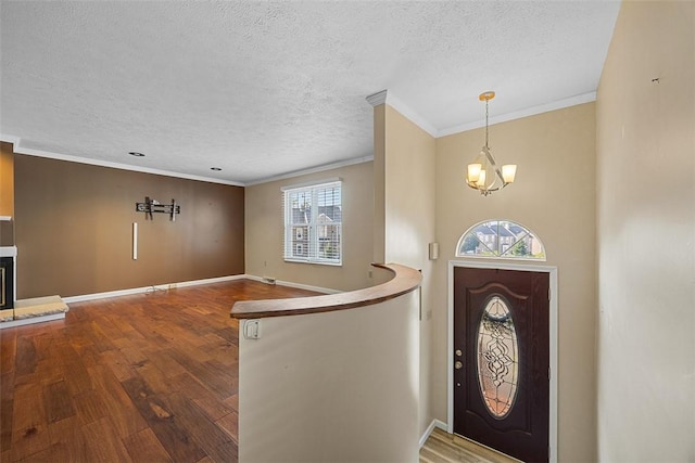 2692 Hunters Point Dr, Franklin Park, PA 15090 - foyer entrance with wood finished floors, crown molding, a textured ceiling, and a chandelier