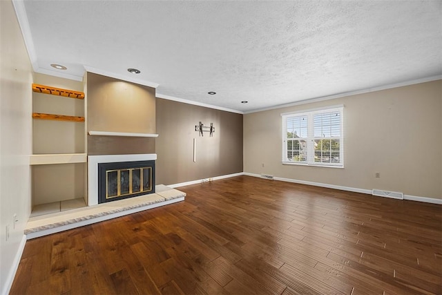 2692 Hunters Point Dr, Franklin Park, PA 15090 - unfurnished living room featuring a glass covered fireplace, ornamental molding, wood finished floors, recessed lighting, and a textured ceiling