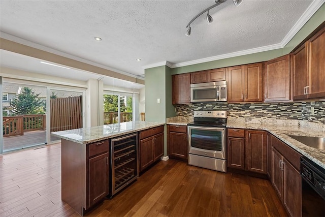2692 Hunters Point Dr, Franklin Park, PA 15090 - kitchen with appliances with stainless steel finishes, wine cooler, a peninsula, a textured ceiling, and ornamental molding