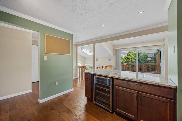 2692 Hunters Point Dr, Franklin Park, PA 15090 - kitchen with beverage cooler, light stone counters, dark wood finished floors, a textured ceiling, and crown molding
