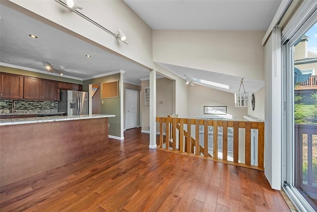 2692 Hunters Point Dr, Franklin Park, PA 15090 - kitchen with stainless steel fridge with ice dispenser, wood finished floors, backsplash, light stone counters, and crown molding