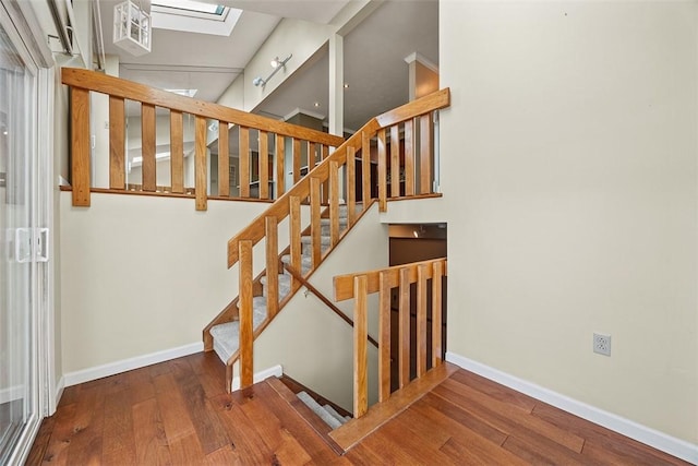 2692 Hunters Point Dr, Franklin Park, PA 15090 - staircase featuring hardwood / wood-style flooring and a skylight