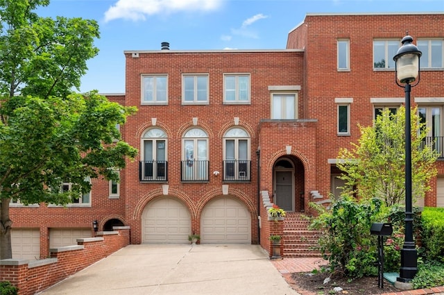 303 Schenley Rd, Squirrel Hill, PA 15217 - view of front facade with driveway, brick siding, and a garage