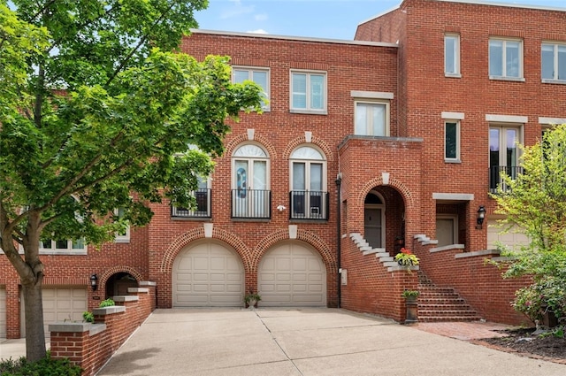 303 Schenley Rd, Squirrel Hill, PA 15217 - view of front of home with brick siding, driveway, and a garage