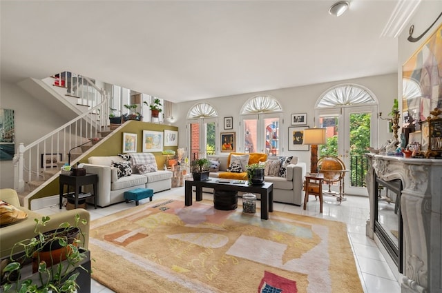 303 Schenley Rd, Squirrel Hill, PA 15217 - living area with light tile patterned floors, stairway, plenty of natural light, and french doors