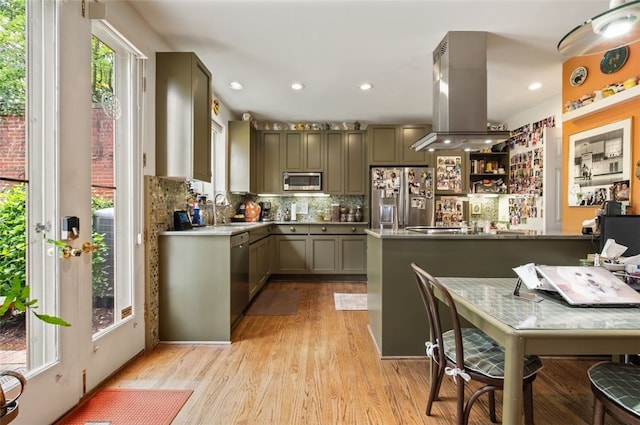 303 Schenley Rd, Squirrel Hill, PA 15217 - kitchen with appliances with stainless steel finishes, plenty of natural light, light wood-type flooring, island range hood, and recessed lighting