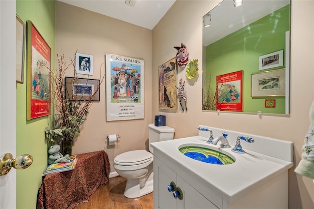 303 Schenley Rd, Squirrel Hill, PA 15217 - half bathroom featuring vanity and wood finished floors