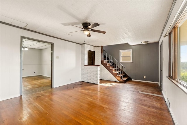 1307 Wade St, Aliquippa, PA 15001 - unfurnished living room with ceiling fan, stairs, and wood finished floors