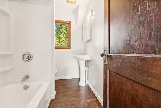 1307 Wade St, Aliquippa, PA 15001 - bathroom featuring wood finished floors and shower / washtub combination