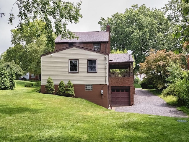 1907 Shaler Dr, Shaler, PA 15116 - view of home's exterior with an attached garage, a chimney, a lawn, driveway, and a balcony