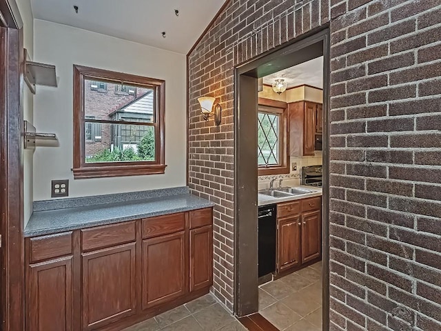 1907 Shaler Dr, Shaler, PA 15116 - bar featuring black dishwasher, plenty of natural light, tile patterned floors, and vaulted ceiling