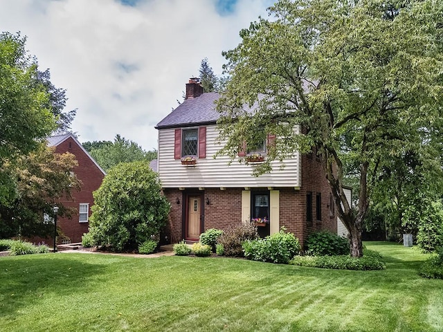 1907 Shaler Dr, Shaler, PA 15116 - colonial house featuring a front yard, brick siding, and a chimney