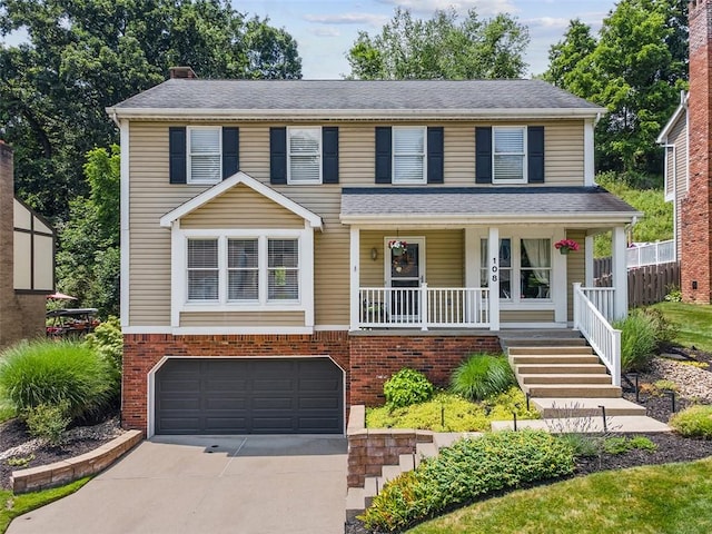 108 Oak Pointe Dr, Monroeville, PA 15146 - view of front of house with a garage, concrete driveway, a porch, a chimney, and brick siding