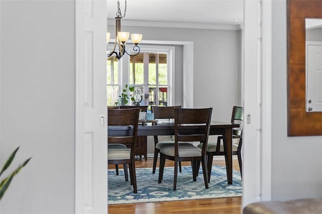 108 Oak Pointe Dr, Monroeville, PA 15146 - dining room with a chandelier, wood finished floors, and ornamental molding
