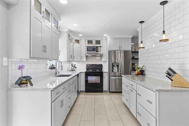 108 Oak Pointe Dr, Monroeville, PA 15146 - kitchen featuring stainless steel appliances, backsplash, light stone countertops, and recessed lighting