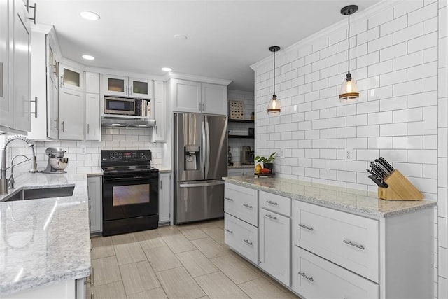 108 Oak Pointe Dr, Monroeville, PA 15146 - kitchen with appliances with stainless steel finishes, backsplash, white cabinetry, hanging light fixtures, and light stone countertops