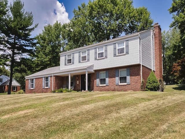 141 Clover Ln, Pine Twp, PA 15044 - view of front of property featuring a chimney, a front lawn, and brick siding