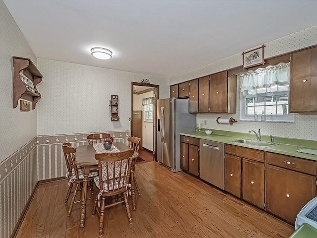 141 Clover Ln, Pine Twp, PA 15044 - kitchen featuring wallpapered walls, stainless steel appliances, light wood-style flooring, light countertops, and open shelves