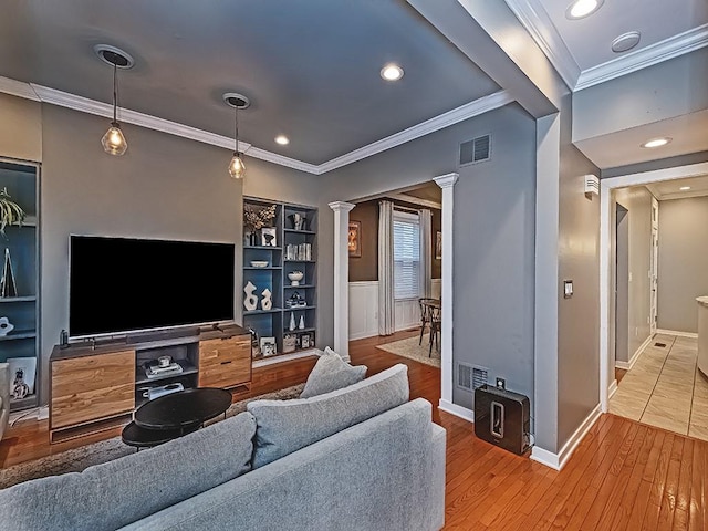410 Bailey Ave, Mt Washington, PA 15211 - living room featuring decorative columns, ornamental molding, hardwood / wood-style floors, built in features, and recessed lighting