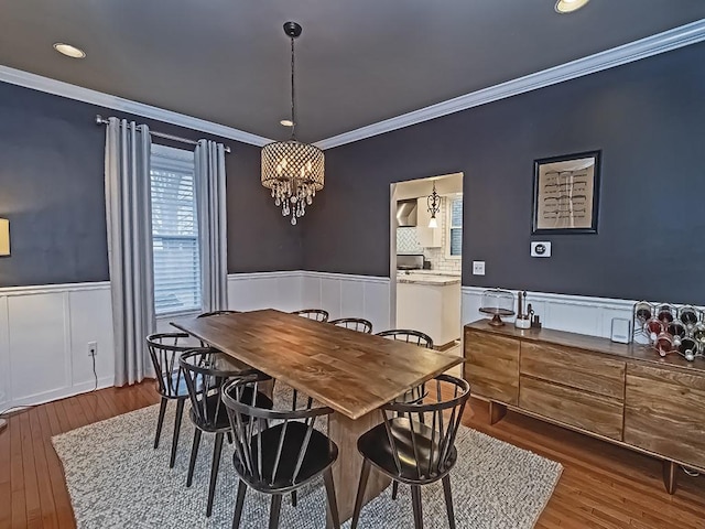 410 Bailey Ave, Mt Washington, PA 15211 - dining area with a wainscoted wall, crown molding, wood finished floors, recessed lighting, and a chandelier